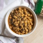 A delicious bowl of chickpeas cooked with mushrooms, highlighting healthy eating.